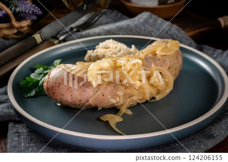 Fried white sausage with onions. Fried white sausage with onions. 124206155