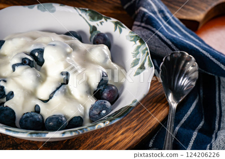 Bowl with yogurt and blueberries. 124206226