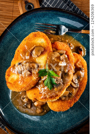 Potato cutlets with mushroom sauce. 124206369