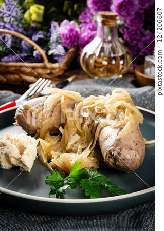 Fried white sausage with onions. Fried white sausage with onions. 124206607