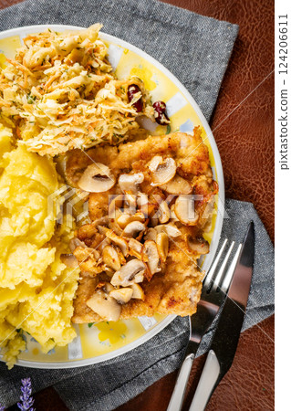 Traditional pork chop with mushrooms. 124206611