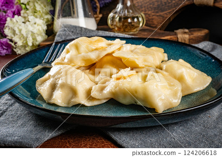 Dumplings, filled with cheese. 124206618