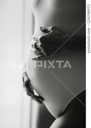 Expectant Mother Embracing Pregnancy with Hand Touch Expectant Mother Embracing Pregnancy with Hand Touch 124206655