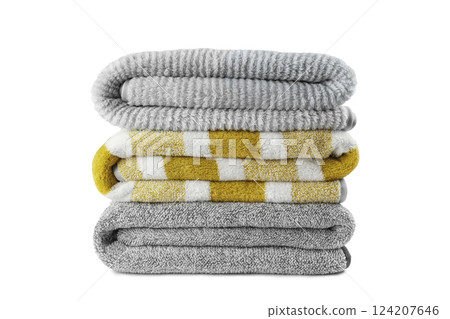 Soft fluffy striped grey and yellow bath towels folded in stack isolated on white background 124207646