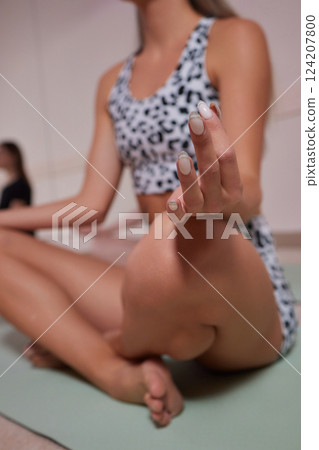 Group of young sporty attractive people practicing yoga lesson with instructor 124207800