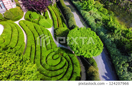 Etretat garden with amazig topiary bushes 124207966