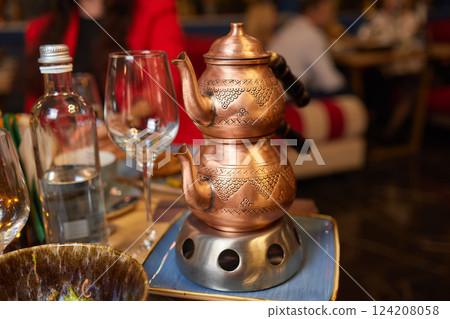 tea urn with glass of tea turkish style tea urn with glass of tea turkish style 124208058