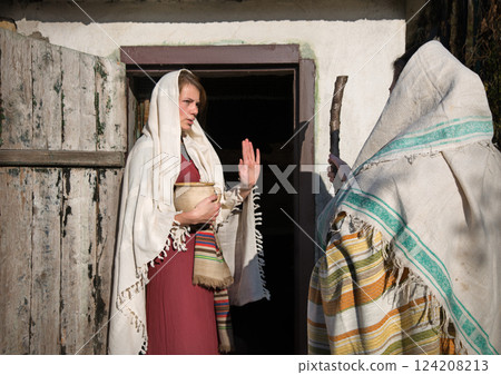 Girl in the door of her home 124208213