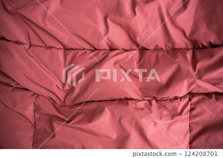 Texture fabric. Textile brown knitted cloth background. Jacket or coat for winter weather. Texture fabric. Textile brown knitted cloth background. Jacket or coat for winter weather. 124208701