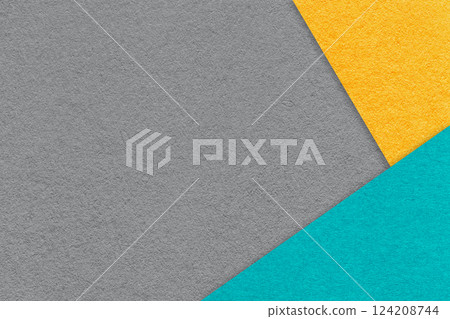 Texture of craft gray color paper background with yellow and turquoise border. Vintage abstract grey cardboard. Texture of craft gray color paper background with yellow and turquoise border. Vintage abstract grey cardboard. 124208744