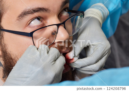 tongue splitting. cutting the tongue, one type of modification of the human body. surgery concept. 124208796