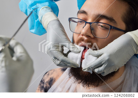 tongue splitting. cutting the tongue, one type of modification of the human body. surgery concept. 124208802