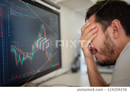 Focused business man trader analyst looking at computer monitor, investor broker analyzing indexes Focused business man trader analyst looking at computer monitor, investor broker analyzing indexes 124209256