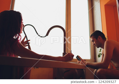A Romantic Bath Scene Depicting a Loving Couple in a Stylish and Modern Bathroom Setting 124209327