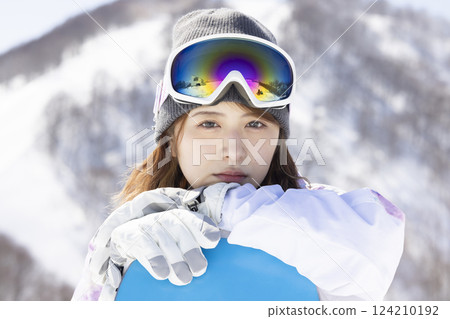 Woman enjoying ski Woman enjoying ski 124210192