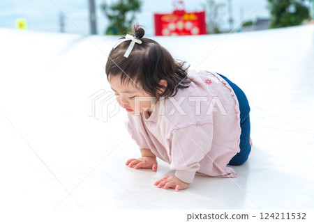[Infants crawling on giant playground equipment] 124211532