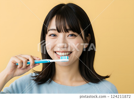 Close-up of a woman smiling and brushing her teeth, AI generated 124211872