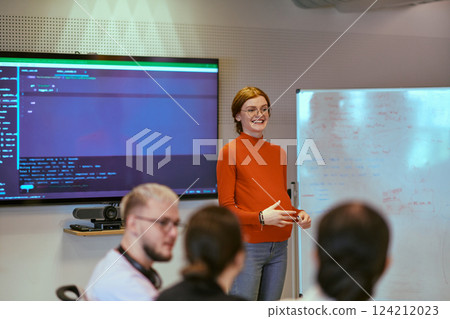 A pregnant business woman with orange hair confidently presents her business plan to colleagues in a modern glass office, embodying entrepreneurship and innovation 124212023