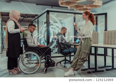 Young group of business people brainstorming together in a startup space, discussing business projects, investments, and solving challenges. 124212069