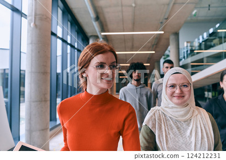 In the sleek corridors of a modern startup office, a diverse group of colleagues, led by their director, confidently stride forward, symbolizing collective success and the journey toward new business 124212231