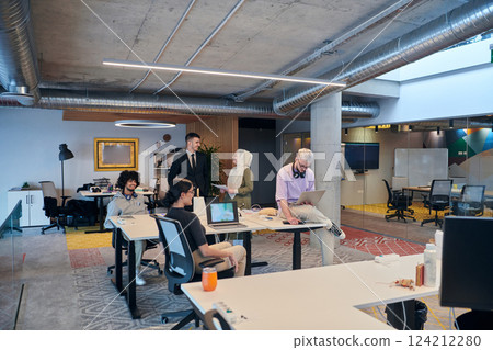 In a modern startup office, a diverse group of young professionals collaboratively tackles various business problems and challenges, surrounded by their engaged colleagues, fostering innovation and In a modern startup office, a diverse group of young professionals collaboratively tackles various business problems and challenges, surrounded by their engaged colleagues, fostering innovation and 124212280