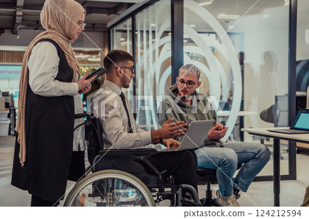 Young group of business people brainstorming together in a startup space, discussing business projects, investments, and solving challenges. 124212594