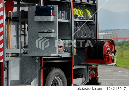 In this detailed close-up, a high-tech rescue tool, meticulously organized within state-of-the-art firefighting vehicles, showcases precision and innovation in life-saving equipment, emphasizing the In this detailed close-up, a high-tech rescue tool, meticulously organized within state-of-the-art firefighting vehicles, showcases precision and innovation in life-saving equipment, emphasizing the 124212647
