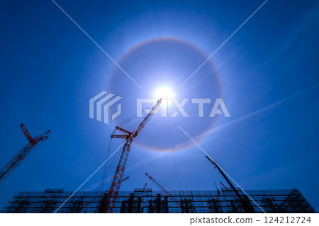 A ring of light appears above a construction site 124212724