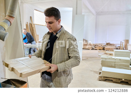 Production Manager Demonstrating Woodcraft Techniques to Employee for Decorative and Residential Items Production Manager Demonstrating Woodcraft Techniques to Employee for Decorative and Residential Items 124212886