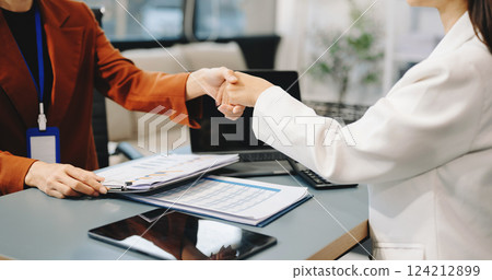 Business partnership handshake concept.Photo two coworkers handshaking process.Successful deal after great meeting. 124212899