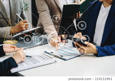 Business and lawyers discussing contract papers with brass scale on desk in office. Law, legal services, advice,  justice and law concept . 124212901