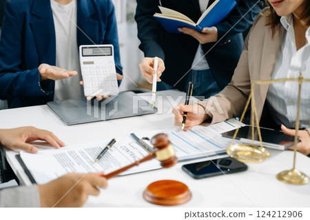 business people and lawyers discussing contract papers sitting at the table. Concepts of law, advice, legal services. 124212906