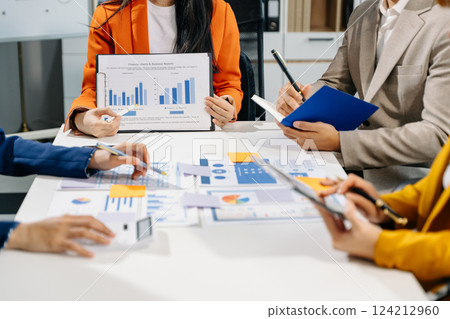 Business team meeting present.professional investor working with Finance managers task. with laptop smart phone and digital tablet Business team meeting present.professional investor working with Finance managers task. with laptop smart phone and digital tablet 124212960