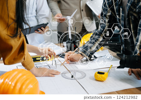 Engineer teams meeting working together wear worker helmets hardhat on construction site 124212982