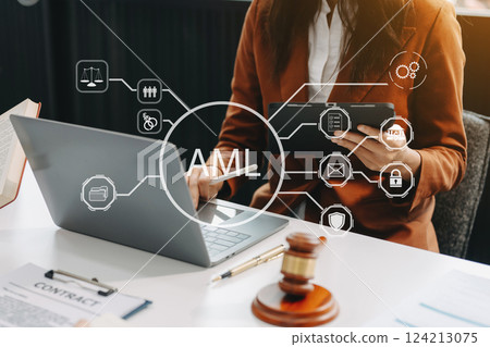 AML Anti Money Laundering Financial Bank Business Concept. judge in a courtroom using laptop and tablet with AML anti money laundering icon 124213075