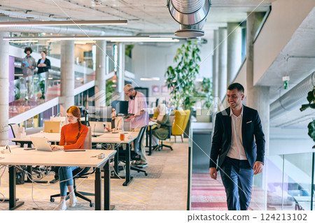 In a modern startup office, a diverse group of young professionals collaboratively tackles various business problems and challenges, surrounded by their engaged colleagues, fostering innovation and 124213102