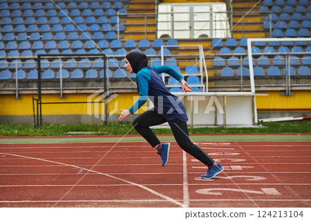 A muslim woman in a burqa sports muslim clothes running on a marathon course and preparing for upcoming competitions A muslim woman in a burqa sports muslim clothes running on a marathon course and preparing for upcoming competitions 124213104