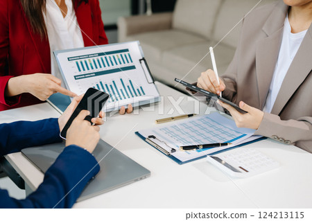 Business team meeting present.professional investor working with  Finance managers task. with laptop smart phone and digital tablet 124213115