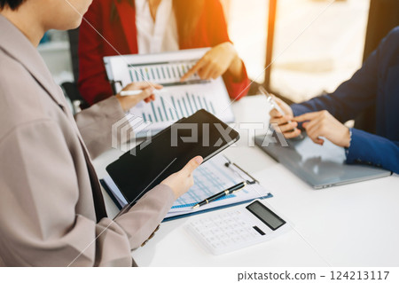 Business team meeting present.professional investor working with Finance managers task. with laptop smart phone and digital tablet Business team meeting present.professional investor working with Finance managers task. with laptop smart phone and digital tablet 124213117