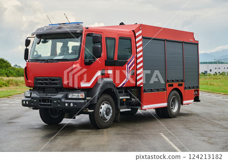 In this captivating scene, a state-of-the-art firetruck, equipped with advanced rescue technology, stands ready with its skilled firefighting team, prepared to intervene and respond rapidly to In this captivating scene, a state-of-the-art firetruck, equipped with advanced rescue technology, stands ready with its skilled firefighting team, prepared to intervene and respond rapidly to 124213182