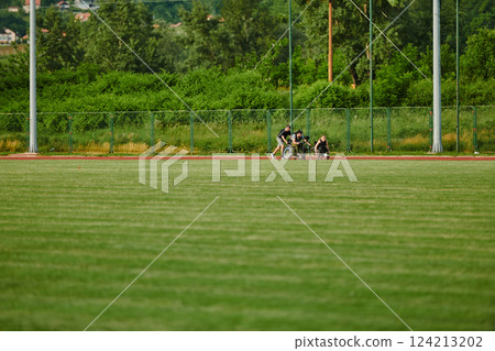 A cameraman filming the participants of the Paralympic race on the marathon course 124213202