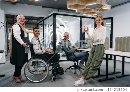 Young group of business people brainstorming together in a startup space, discussing business projects, investments, and solving challenges 124213204