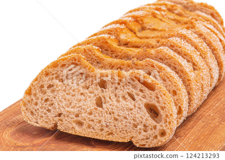 Bread cut into slices on a wooden board. Buckwheat bread. 124213293