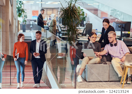 In a modern startup office, a diverse group of young professionals collaboratively tackles various business problems and challenges, surrounded by their engaged colleagues, fostering innovation and 124213524