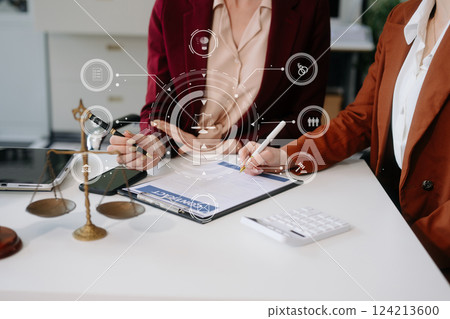 Business and lawyers discussing contract papers with brass scale on desk in office. Law, legal services, advice, Business and lawyers discussing contract papers with brass scale on desk in office. Law, legal services, advice, 124213600