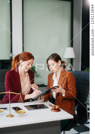 Modern lawyer office a professional discussion, legal documents, and teamwork. Perfect for business, legal advice Modern lawyer office a professional discussion, legal documents, and teamwork. Perfect for business, legal advice 124213694