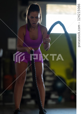 Fit Woman Performing Rope Conditioning Exercise in the Gym Fit Woman Performing Rope Conditioning Exercise in the Gym 124215066