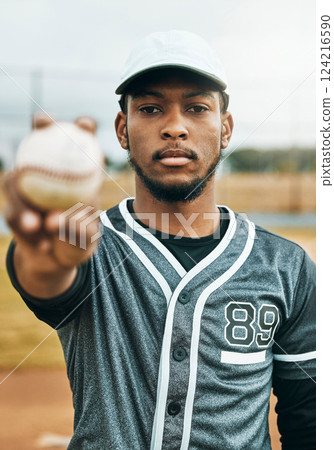 Baseball, sports and ball with a black man athlete on a grass pitch or field before a game for fitness and exercise. Training, workout and health with a male baseball player ready for a game outside Baseball, sports and ball with a black man athlete on a grass pitch or field before a game for fitness and exercise. Training, workout and health with a male baseball player ready for a game outside 124216590