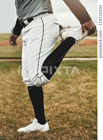 Baseball player, stretching and man on sports field doing warm up exercise, workout training at baseball field. Sports, baseball player and body preparation with athletic guy getting ready for match Baseball player, stretching and man on sports field doing warm up exercise, workout training at baseball field. Sports, baseball player and body preparation with athletic guy getting ready for match 124216592