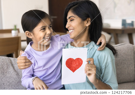 Little girl and her mum celebrate family holiday together Little girl and her mum celebrate family holiday together 124217706